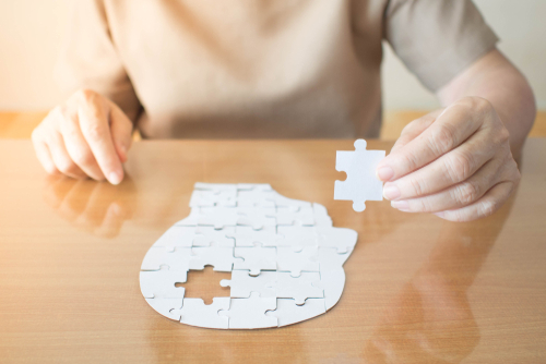 elderly woman with dementia and a jigsaw puzzle